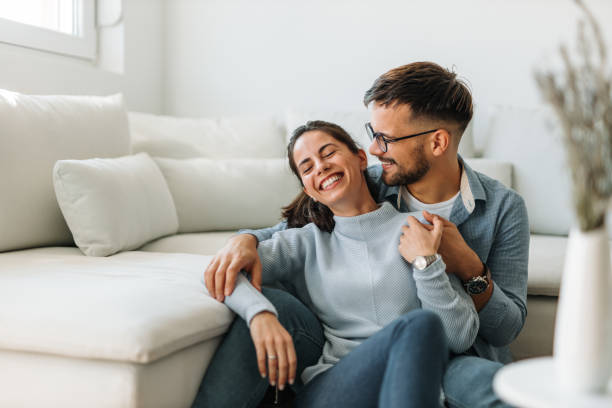 istock Hugging each other, both having wrist watches. 1298330140