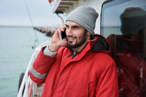 istock Fisherman holding phone and discussing something 1298331662