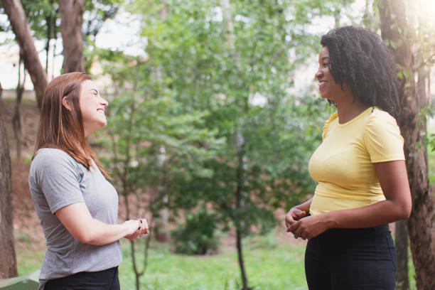 istock Two friends on the park 1298332185