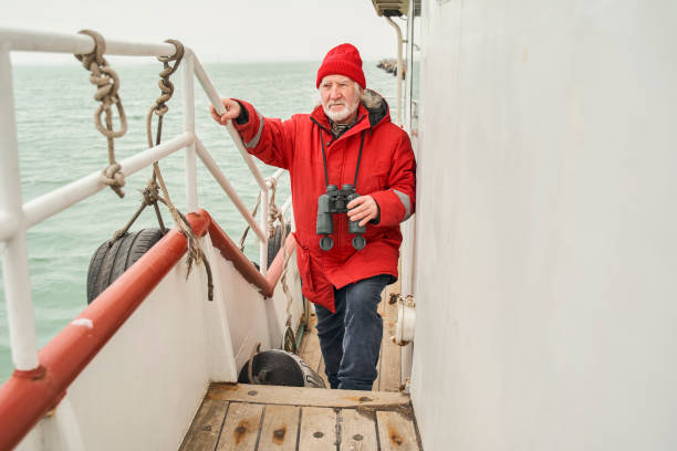 istock Fisherman walking through the boat while preparing to fishing 1298334155