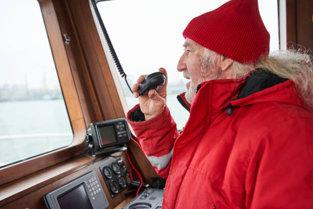 istock Senior man talking something at the walkie-talkie 1298334227