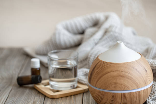 istock Composition with an air humidifier and a set of aromatic oils. 1298336139