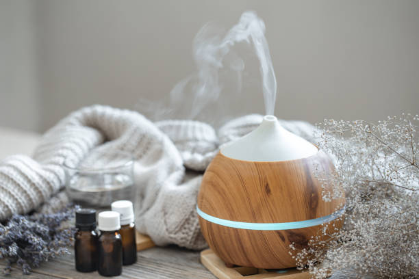 istock Composition with an air humidifier and a set of aromatic oils. 1298336140