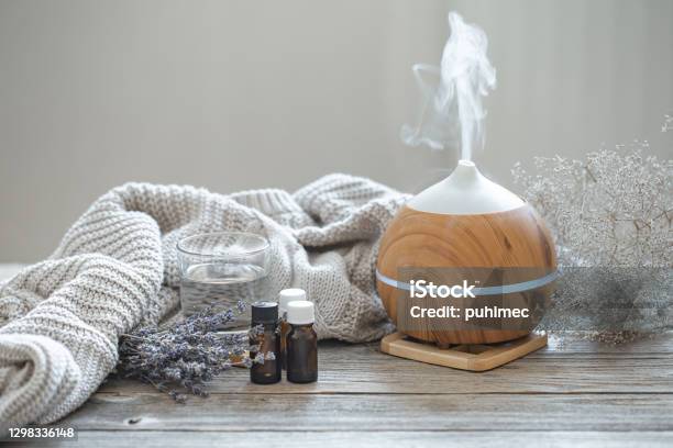 Composition With An Air Humidifier And A Set Of Aromatic Oils Stock Photo - Download Image Now