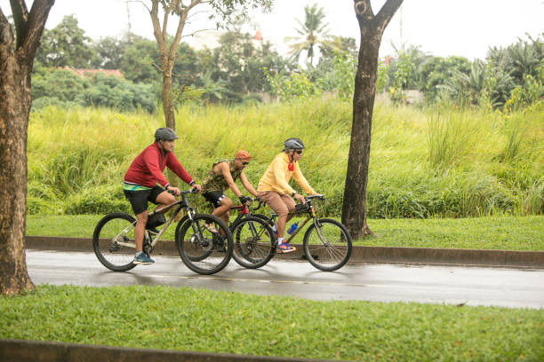 istock group of people riding bicycles in the morning 1298337714