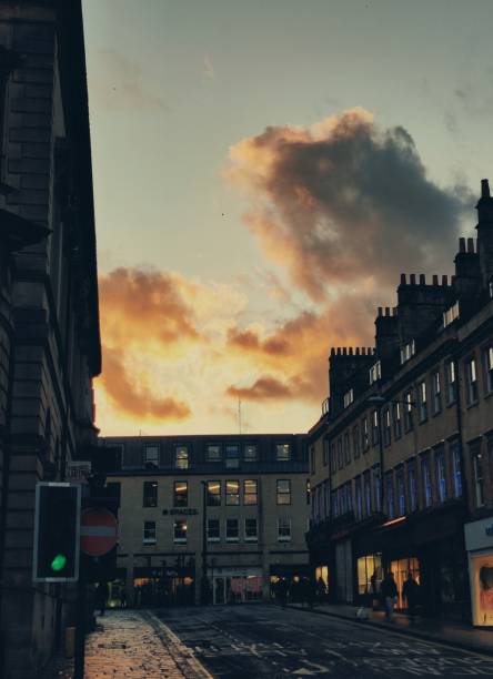 istock Sunset with cloudy sky on the street 1298337832