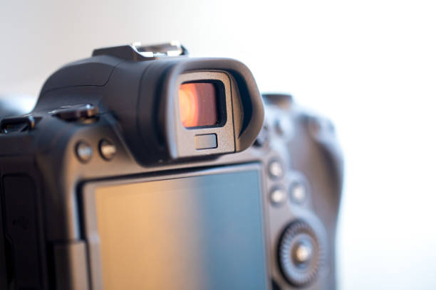 istock Close up part of a professional digital camera on a blurred background. 1298337997
