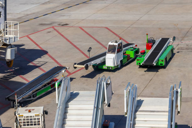 istock Belt luggage loader vehicles in the airport 1298338622