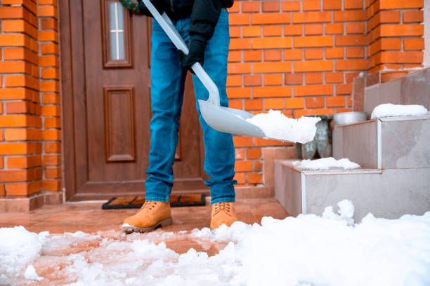 istock Cleaning the snow with plastic shovel 1298339843