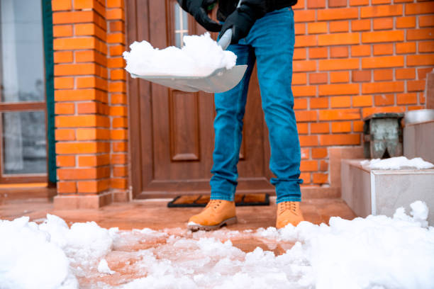 istock Shoveling Home entrance on winter day 1298341046