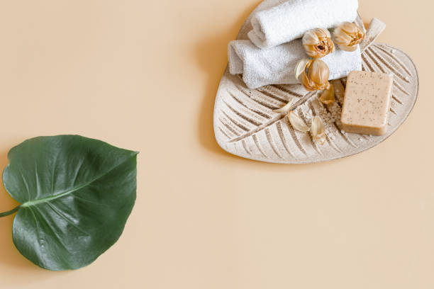 istock Spa composition with bath accessories and flowers top view. 1298341096