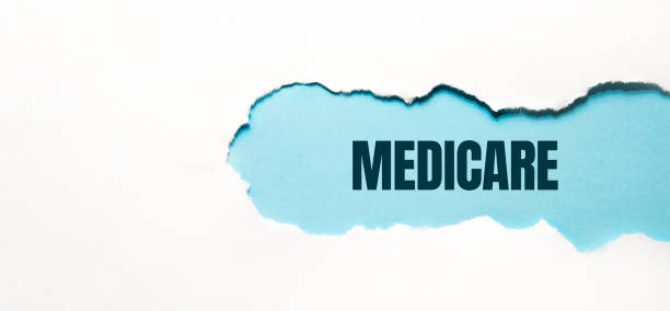 MEDICARE word made on torn papper, medical concept background.