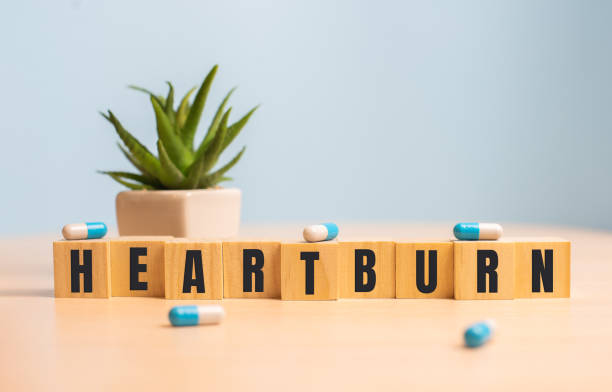 istock Heartburn word concept on wooden cubes on blue 1298343027