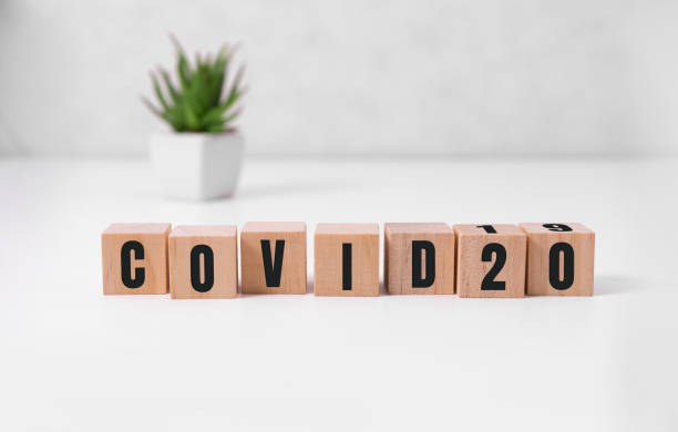 istock the word covid20 . Beautiful grey background. Concept. Copy space 1298343028