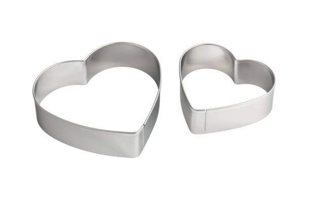 istock Two stainless steel heart-shaped cookie cutters, isolated 1298343229