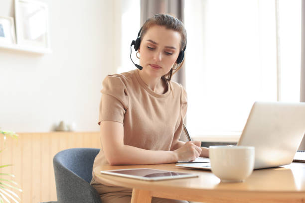 istock Freelance business women using tablet working call video conference with customer in workplace at home. 1298345211