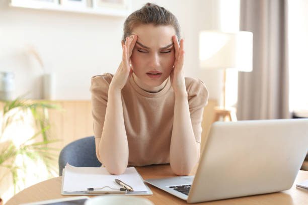 istock Tired young girl student sitting at table, leaning head on hands, napping during break pause time at home. 1298347409