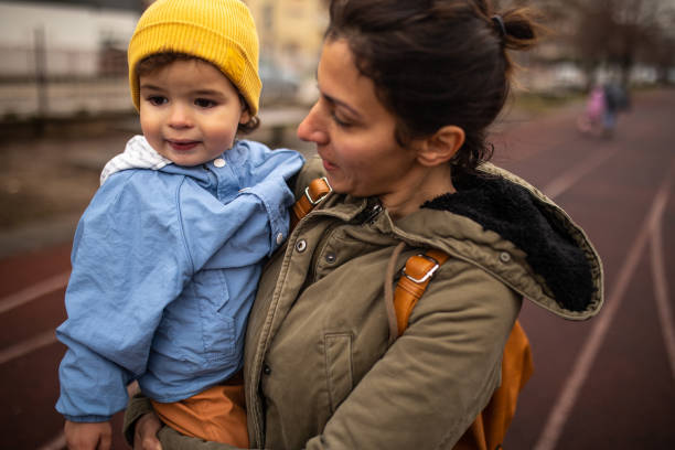 istock Mother and son in a walk during autumn day 1298350720