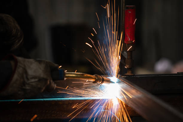istock Metal worker using a grinder stock photo 1298351111