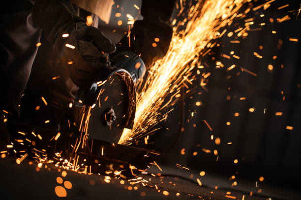 istock Metal worker using a grinder stock photo 1298351843