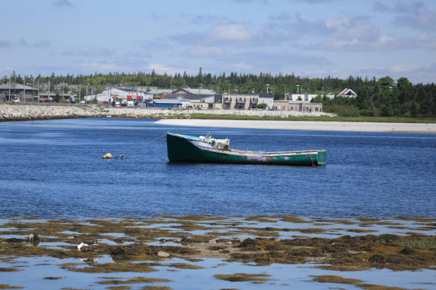 istock Damaged boat at anchor 1298353058