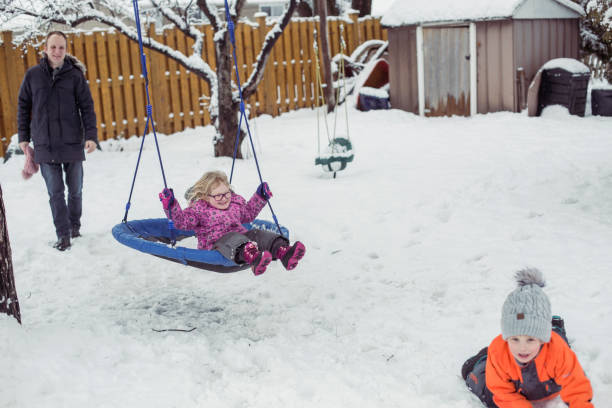 istock Young little girl on a swing 1298353156