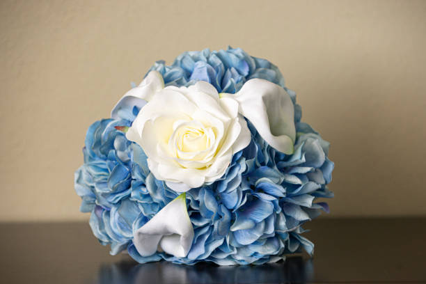 istock Bride's White and Blue Roses Bouquet Ball 1298353342