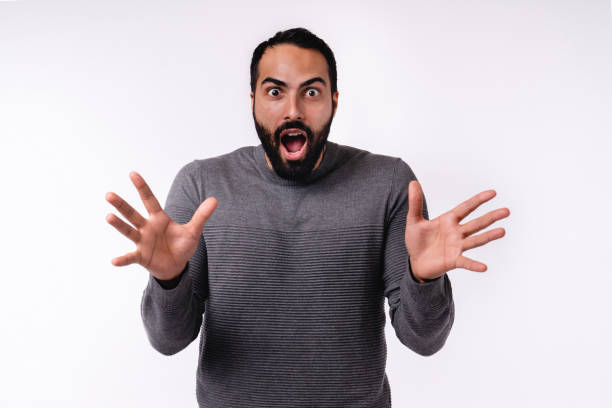 istock Scared young handsome islamic man in casual attire isolated over white background 1298354040
