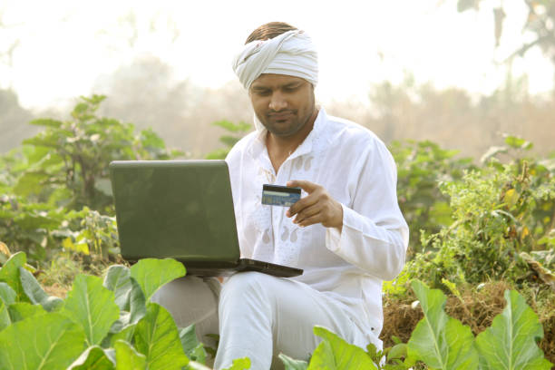 istock indian farmer using laptop.Credit Card, 1298354122