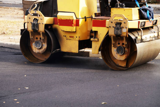 istock asphalt paver close up on the road 1298354186