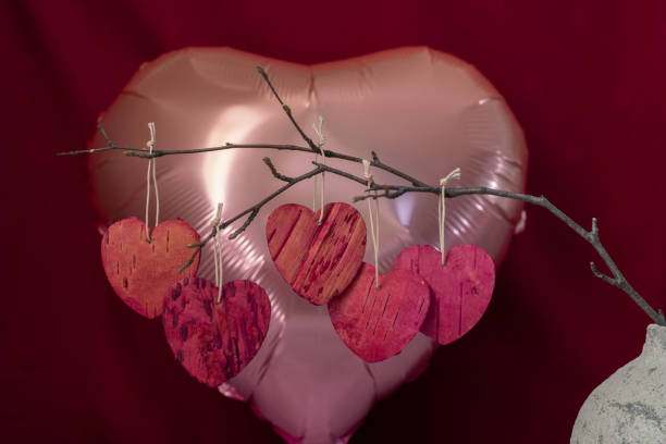 istock Heart shaped branch with leaves from tree bark 1298356255