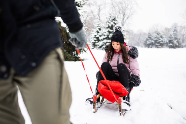 istock A young woman afraid of how fast her sled is going 1298361678