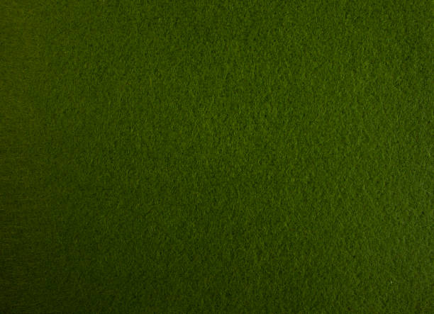 istock Dark green felt, closeup fabric texture as nice background 1298367327