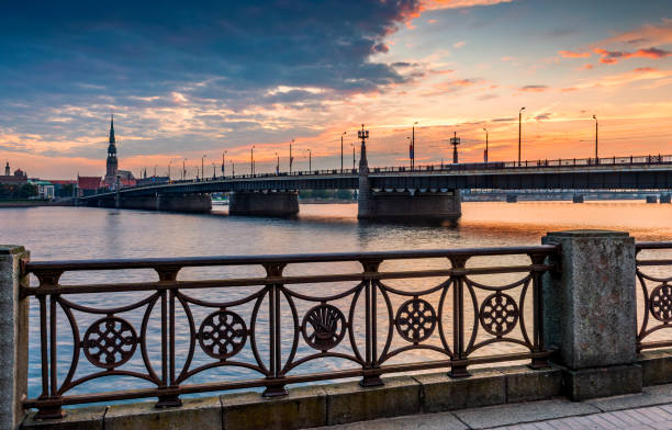 istock Stone bridge through the Daugava river in center of Riga 1298370132