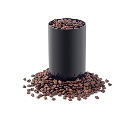 Electric coffee mill in coffee beans heap