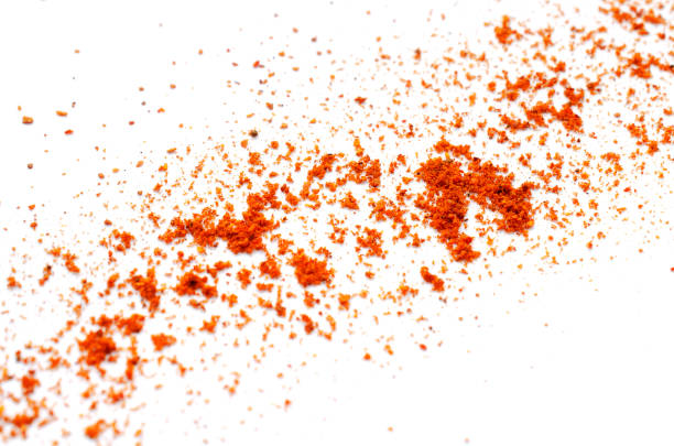 Pile of red pepper powder on a white background. Cayenne pepper powder, top view. Red pepper paprika powder isolated on white background, top view. Pile of red powder isolated on white background. Pile of red pepper powder on a white background. Cayenne pepper powder, top view. Red pepper paprika powder isolated on white background, top view. Pile of red powder isolated on white background cayenne powder stock pictures, royalty-free photos & images