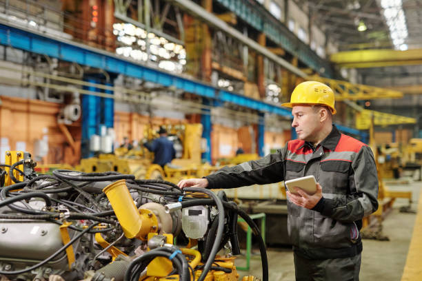 istock Worker working with equipment in the plant 1298373257