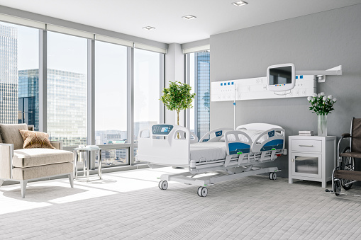 Interior of a modern luxury hospital room with city view.