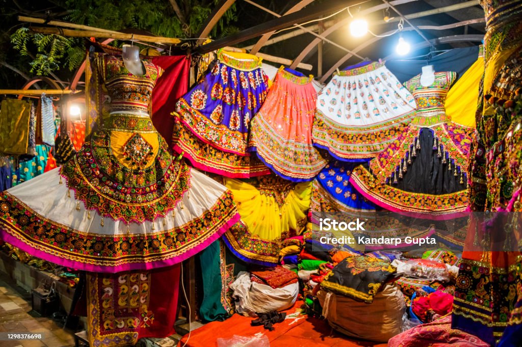 Colorful handicrafts for sale in Law Garden. Ahmedabad Navratri in Gujarat means a nine-night festival full of dance, music, and a lot of fun! The dance form that is performed during Navratri is Ras Garba, which is also sometimes followed by Dandiya. The atmosphere during the festival is eclectic and joyful Navratri Stock Photo