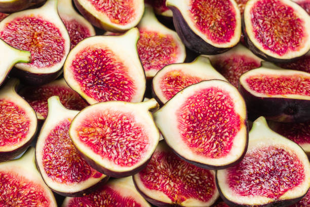 istock Tasty figs background. Top view. 1298382346