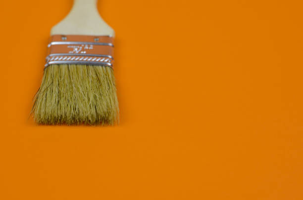 Brush for painting on a brown background close up
