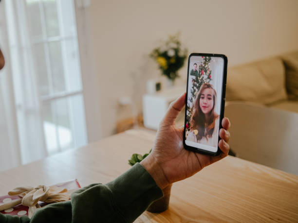 istock Young couple making a video conference at Christmas time 1298384719