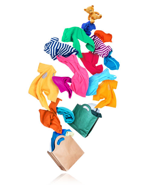 istock Bright colored clothes are flying out from paper packages on white background 1298388079