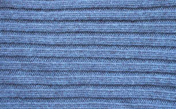 istock Seamless knitted fabric. Knitted sweater, plaid, scarf. Knitted background 1298389330