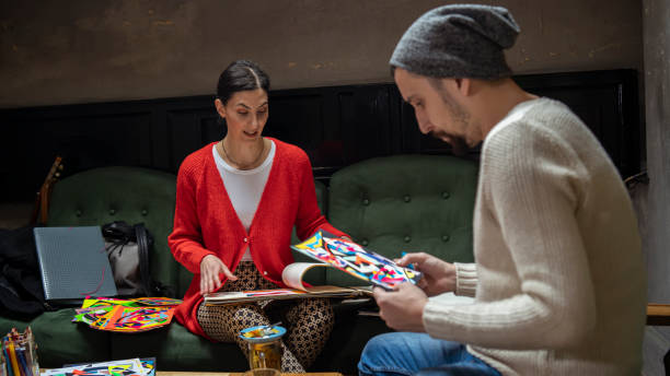 istock Two artist brainstorming in a coffee shop 1298389404