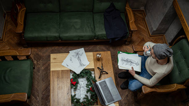 istock Artist working on a drawing in a cafe 1298389407