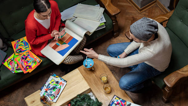 Two freelance artists, designers, working in coffee shop