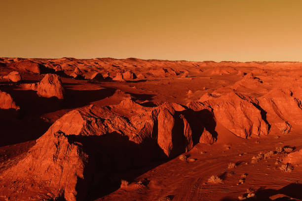 istock Fantastic martian landscape in rusty orange shades, Mars surface, Desert, Cliffs, sand. Alien landscape. Red planet mars 1298390091