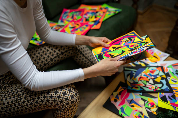istock Freelance artist arranging small format paintings 1298391280