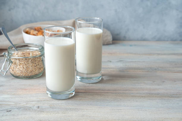 istock Breakfast with fresh milk on a gray background. Side view with copy space 1298396336